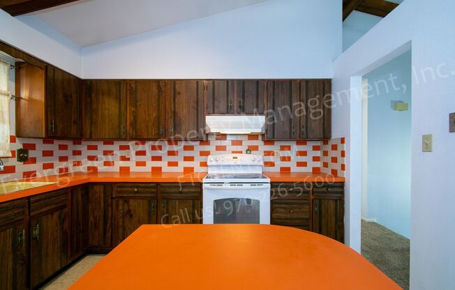 Charming Bi-Level Home in Desirable Mission Hills with a Sunroom, A/C and a Fireplace!