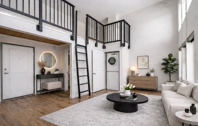 A modern living room with a black and white color scheme.