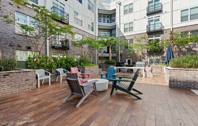 an outdoor patio with chairs and tables on a