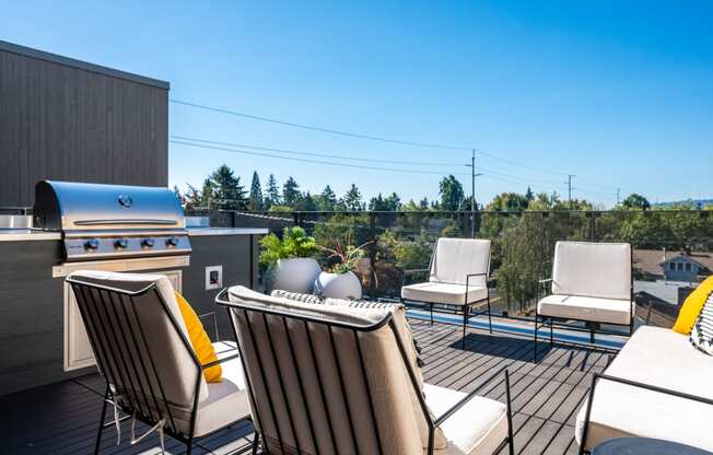 Southeast Portland, OR Pet-Friendly Apartments - The Lenox - Rooftop Lounge with Lounge Seating, Grill Station, and Neighborhood Views