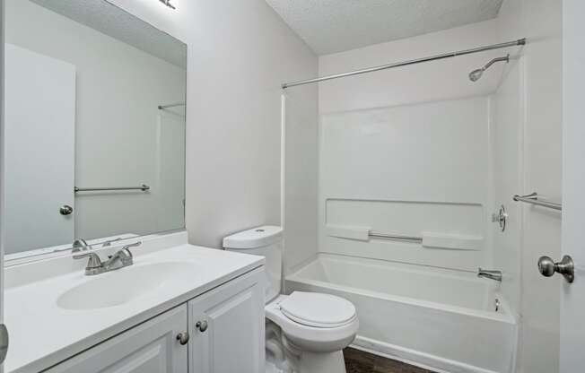 Chelsea Apartments in Gainesville Florida photo of bathroom with white cabintry