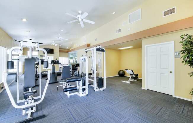 Weight training machines in gym of Ventana Apartment Homes in Central Scottsdale, AZ, For Rent. Now leasing 1 and 2 bedroom apartments.