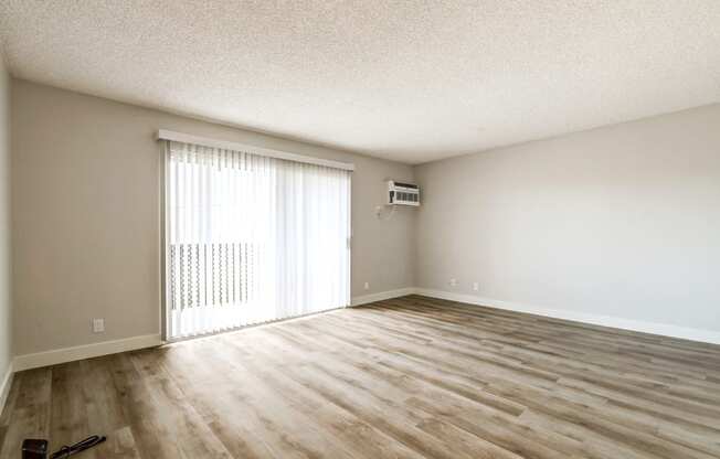 living room with hard wood floor and sliding glass door