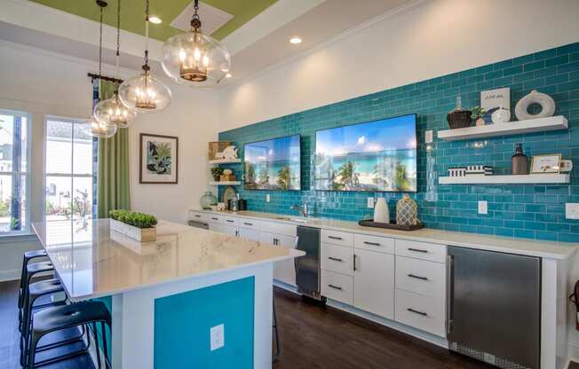 a kitchen with blue tiles and a white counter top