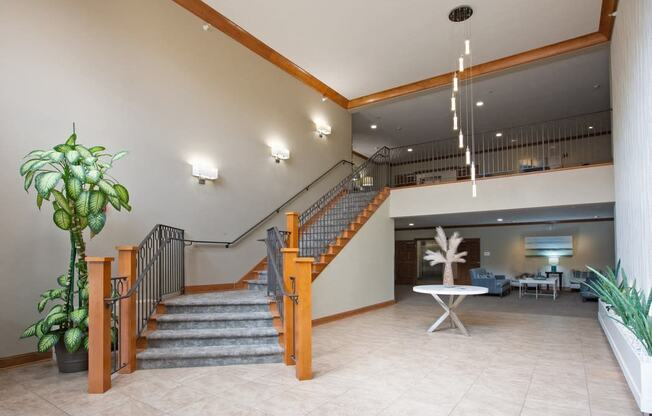 Laurel East End Apartments in Golden Valley, MN photo of the lobby of a building with a staircase and a potted plant