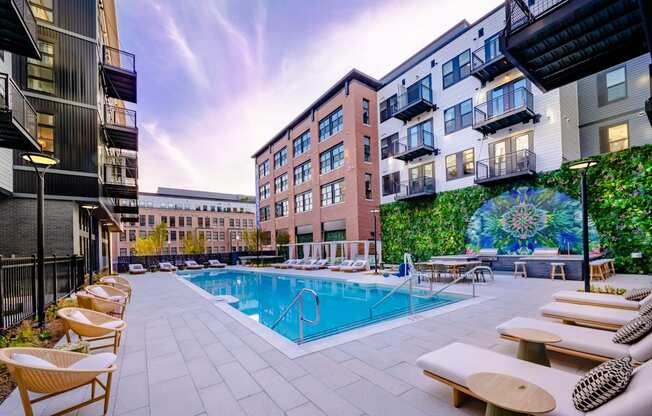 Outdoor pool with lounge chairs and dining area