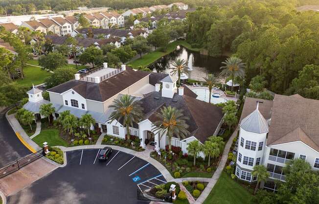 an aerial view of a large estate with a large swimming pool