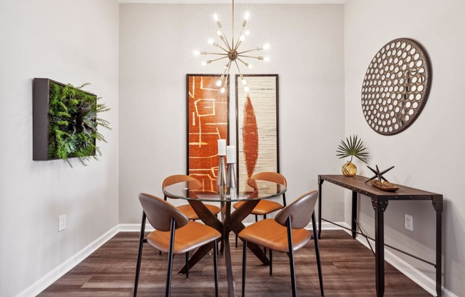 a dining room with a table and chairs at Metro 303, Hempstead, 11550