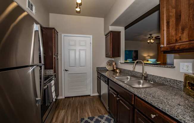 Kitchen with appliances and cabinets at The Belmont by Picerne, Las Vegas