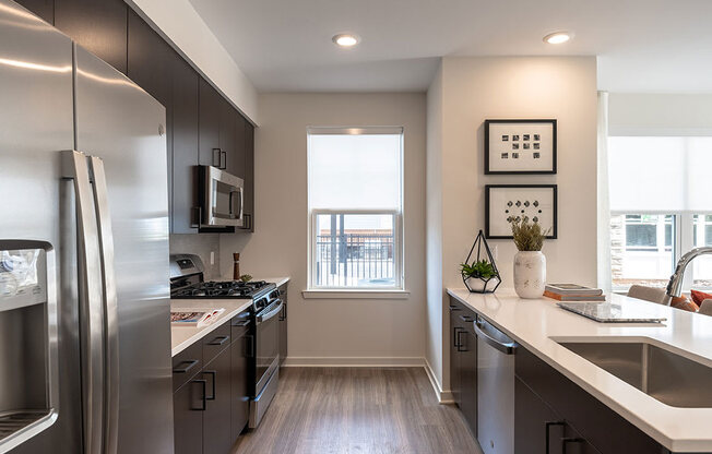 Fully Equipped Kitchen Includes Frost-Free Refrigerator, Electric Range, & Dishwasher at The Grove at Piscataway, Piscataway, New Jersey