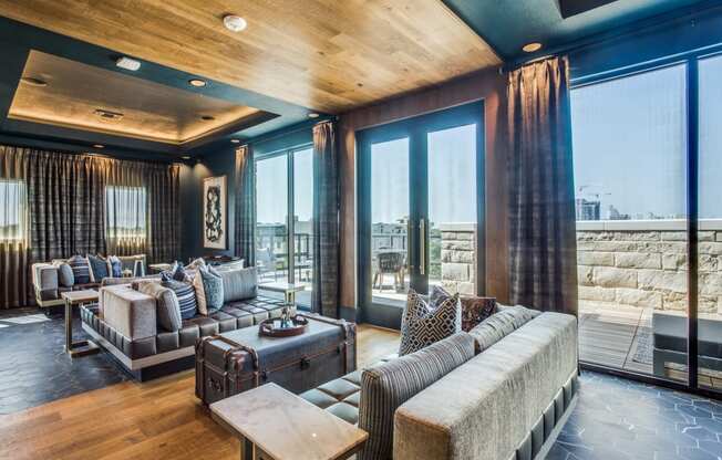 a living room filled with furniture and a large window