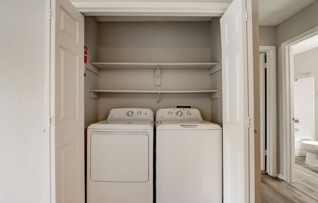 the laundry room has a washer and dryer