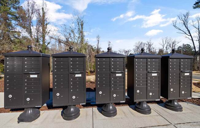 a row of mailboxes sitting on a sidewalk