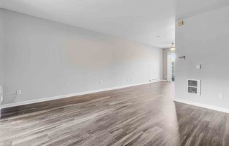 Apartments for Rent San Jose CA - Los Gatos Creek - Living Room with Wood-Style Flooring and Light Grey Walls