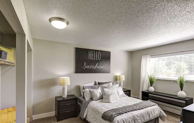 a bedroom with a bed and a window