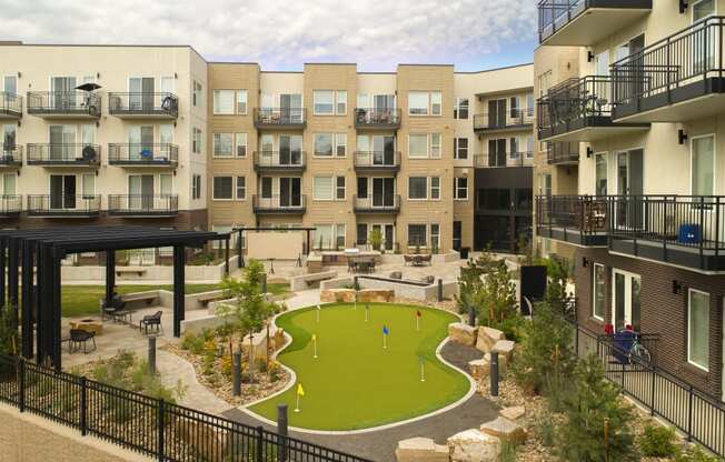 a rendering of an apartment building with a miniature golf course