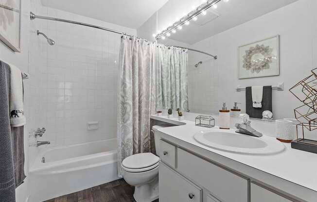 bathroom with a tub and toilet and sink
