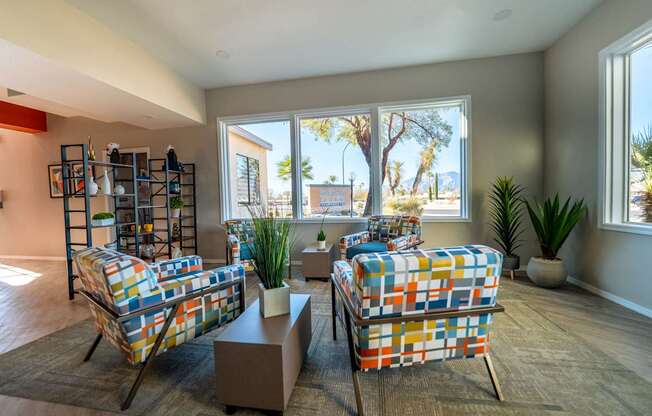 A living room with two chairs and a table.