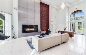 a living room filled with furniture and a fireplace at Plantation Crossing, Lafayette, LA