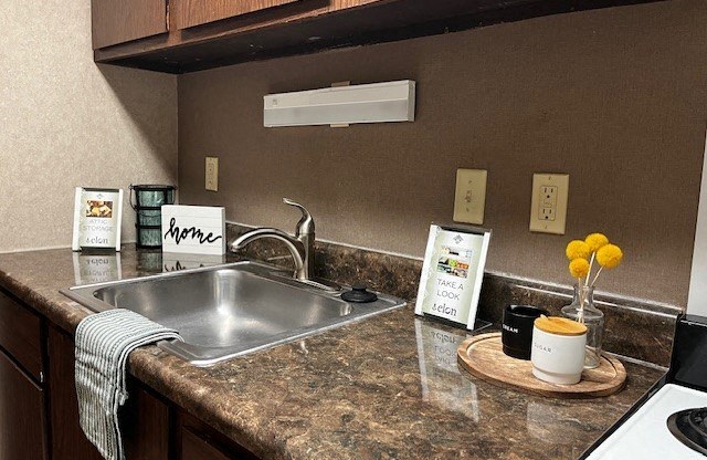 a kitchen with a sink and a counter top