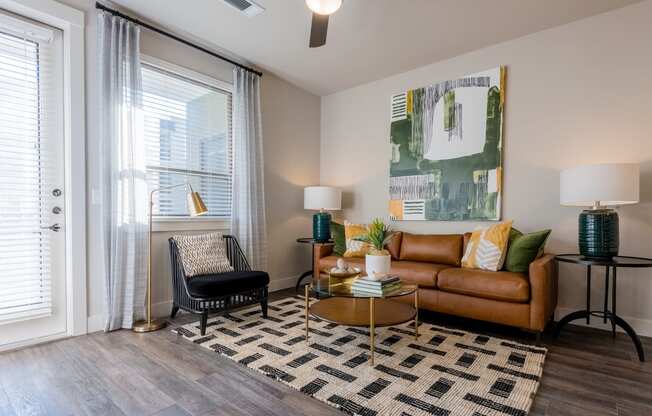 our apartments offer a living room with a couch coffee table and a chair