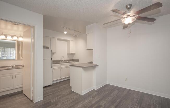 a kitchen with white cabinets