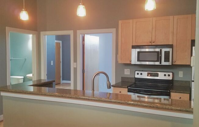 Modern 2 bedroom 2 bath condo located in Eagle Mill Towers.
