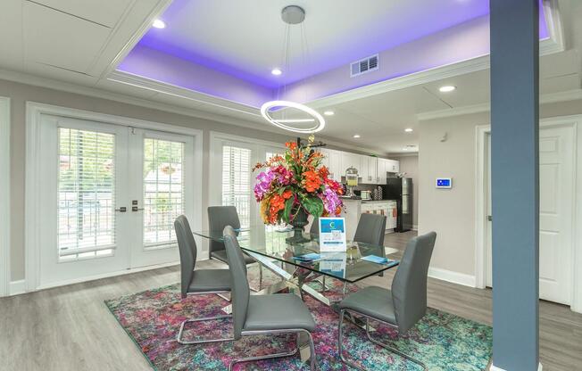 a living room filled with furniture and a large window