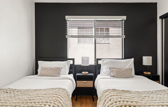 A 4 bedroom, 2 bathroom apartment with common areas and a fully functional kitchen at 1823 Pelham Ave. Unit #7