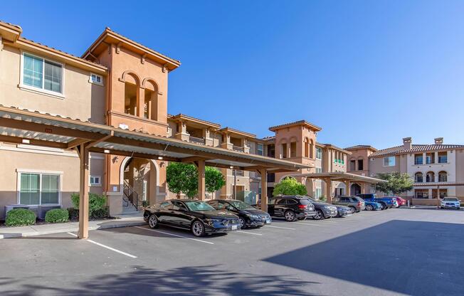 a street with cars parked on the side of a building