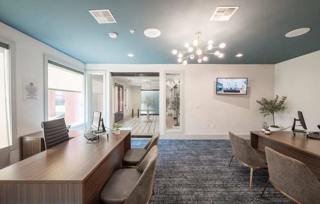 a conference room with a desk and chairs