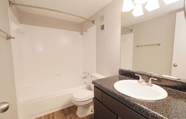 a bathroom with a sink toilet and bathtub