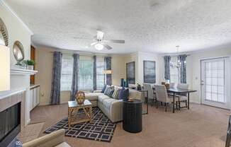 a living room and dining room with a couch and a table