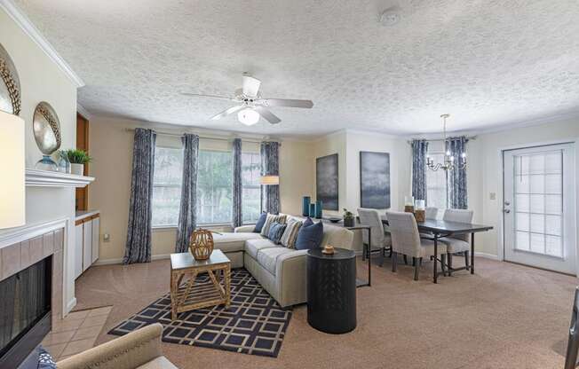 a living room and dining room with a couch and a table