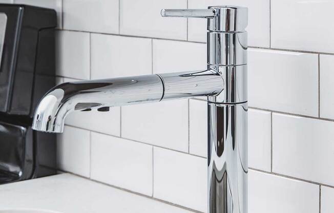 Chrome kitchen faucet with pull down spray head