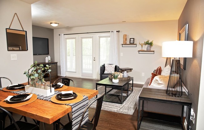 living and dining rooms with hardwood-style flooring