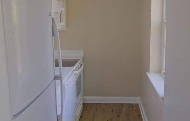 Beautiful corner unit in a secure, all-brick, pet-friendly building