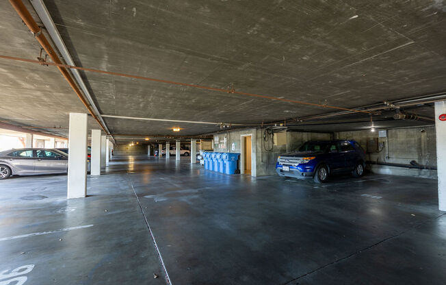 a parking garage with cars parked in it