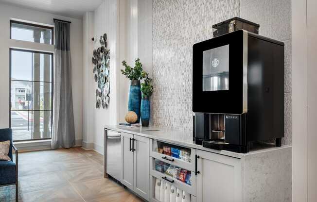 a living room with a television on a counter and a window