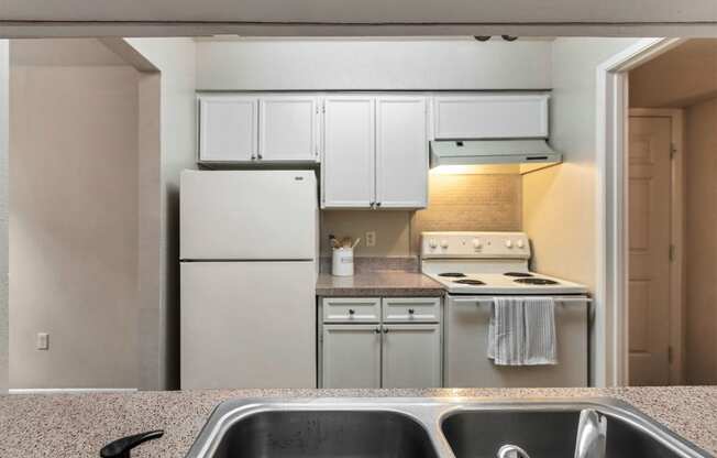 This is a photo of the kitchen in the 650 square foot 1 bedroom, 1 bath apartment at Preston Park Apartments in Dallas, TX