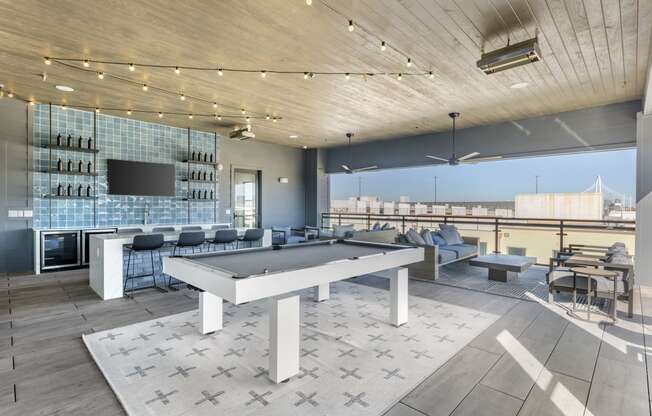a clubhouse with a ping pong table in the middle