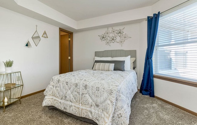 Carpeted Bedroom With Large Window