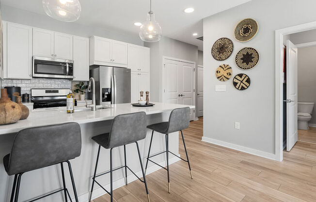 A kitchen with a white counter top and grey bar stools at Madison Prickett Preserve, Pennsylvania