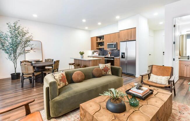 Open-concept living at Modera Higley Commons blends natural textures and sleek finishes for a space that feels both refined and relaxed.