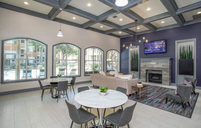 A living room with a fireplace and a television.