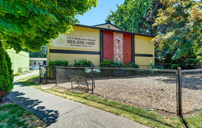 a bench in front of a building with a sign on it