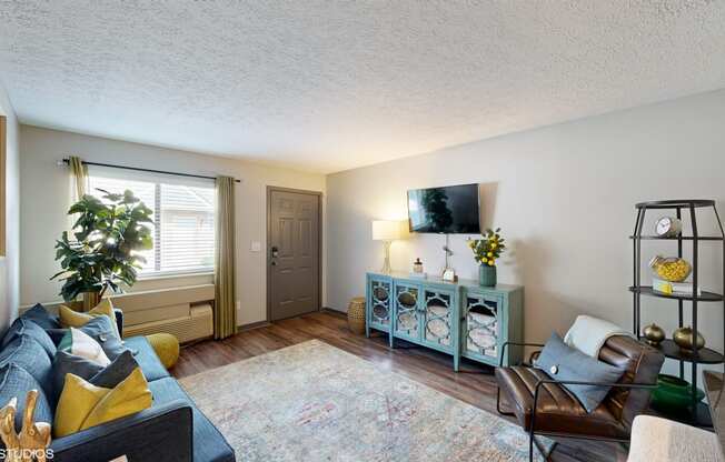 a living room with a couch and a tv