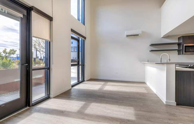 a kitchen and living room with sliding glass doors at Marina Square, WA 98337