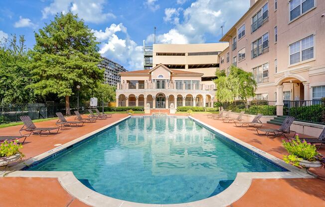 a swimming pool with a building in the background