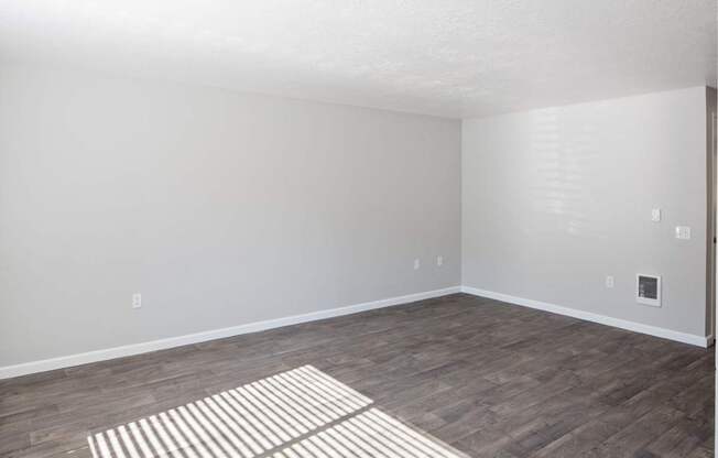 A room with a striped rug on the floor.
